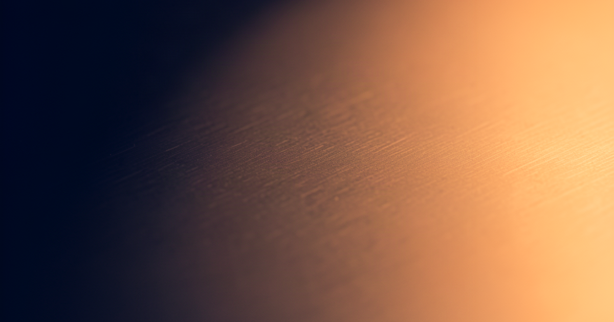 Deep navy-blue to warm amber light gradient across a smooth brushed-metal surface, evoking the Clout Clock leaderboard's daily countdown